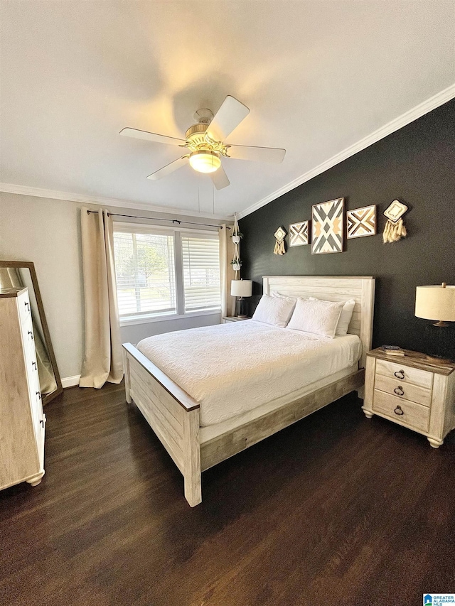 bedroom featuring ornamental molding, dark hardwood / wood-style floors, and ceiling fan