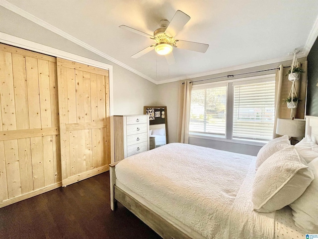 bedroom featuring dark wood-type flooring, crown molding, vaulted ceiling, and ceiling fan