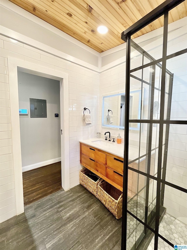 bathroom with sink, hardwood / wood-style floors, electric panel, and wood ceiling