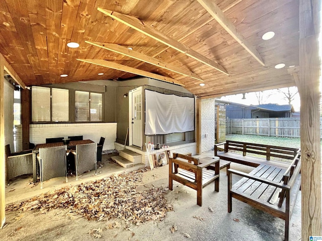 interior space featuring wood ceiling and vaulted ceiling