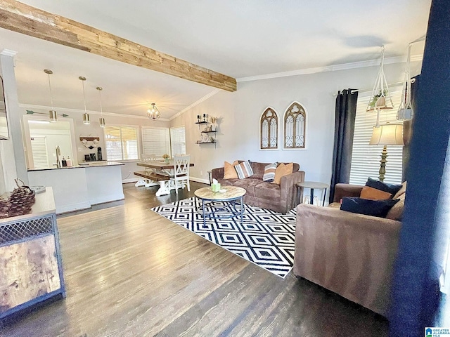 living room featuring vaulted ceiling with beams, ornamental molding, and hardwood / wood-style floors