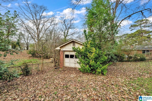 view of yard featuring an outbuilding and a garage