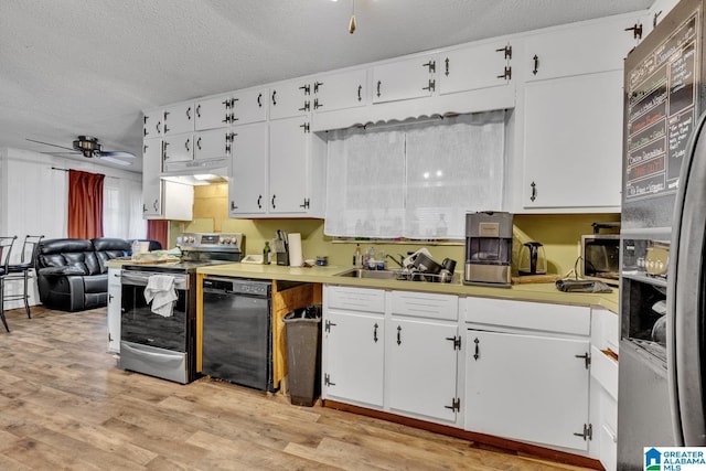 kitchen with white cabinetry, ceiling fan, stainless steel appliances, and light hardwood / wood-style flooring