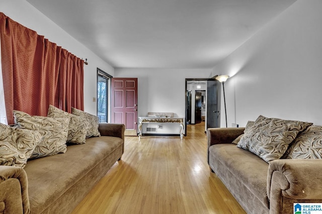 living room with light hardwood / wood-style floors