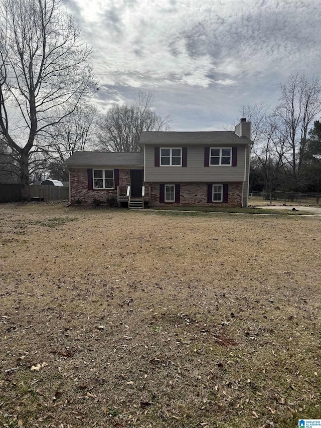 tri-level home featuring a front yard