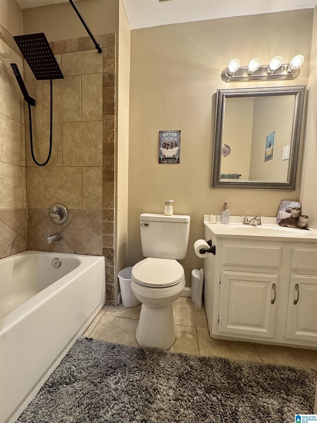 full bathroom with tile patterned flooring, vanity, toilet, and tiled shower / bath