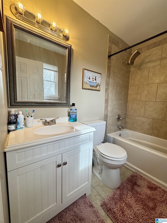 full bathroom with vanity, toilet, tiled shower / bath combo, and tile patterned flooring