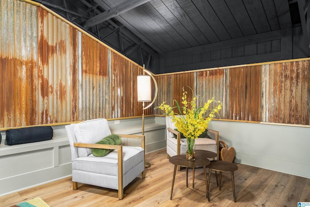 living area with wooden ceiling and light wood-type flooring