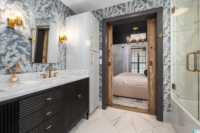 bathroom with a shower with door and vanity