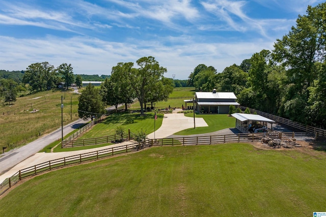 view of community with a rural view and an outbuilding