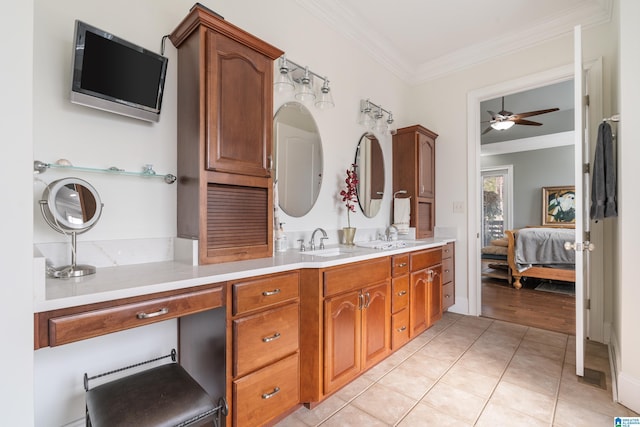 bathroom with vanity, tile patterned flooring, ornamental molding, and ceiling fan