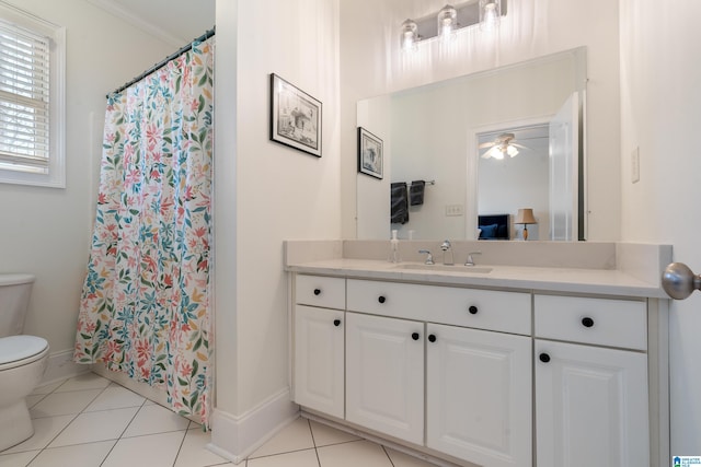 bathroom with tile patterned flooring, vanity, ornamental molding, ceiling fan, and toilet