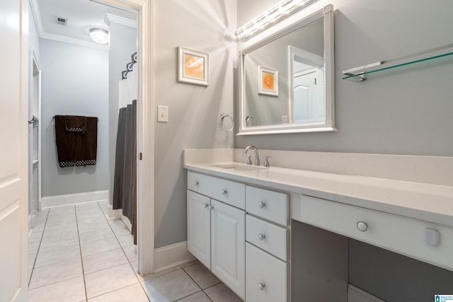 bathroom featuring vanity, crown molding, and tile patterned floors