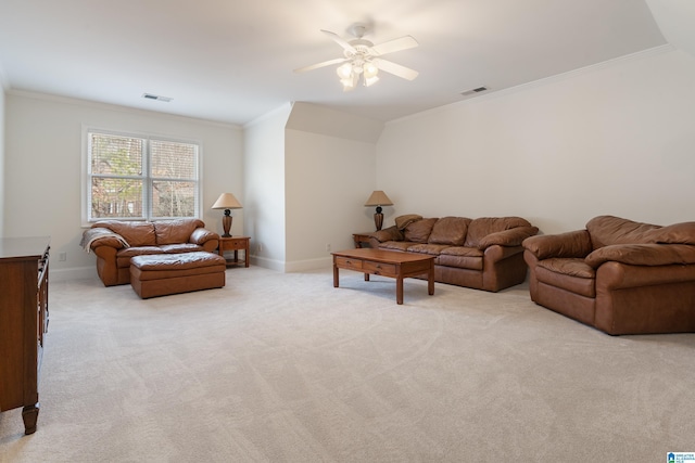 carpeted living room featuring crown molding and ceiling fan