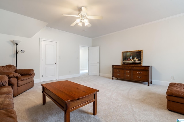 carpeted living room featuring crown molding and ceiling fan