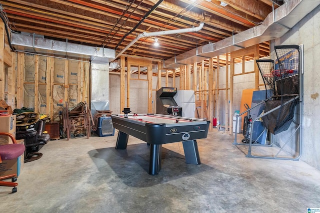 game room with concrete flooring