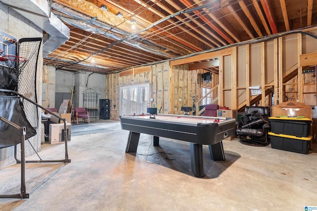 game room featuring concrete flooring