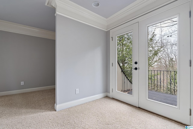 doorway featuring french doors, crown molding, and carpet