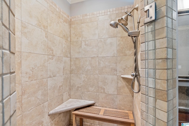 bathroom with a tile shower