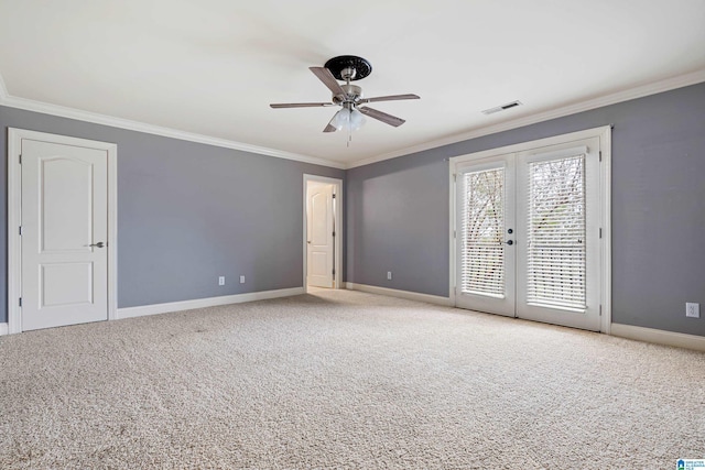 unfurnished room featuring ornamental molding, light colored carpet, ceiling fan, and french doors