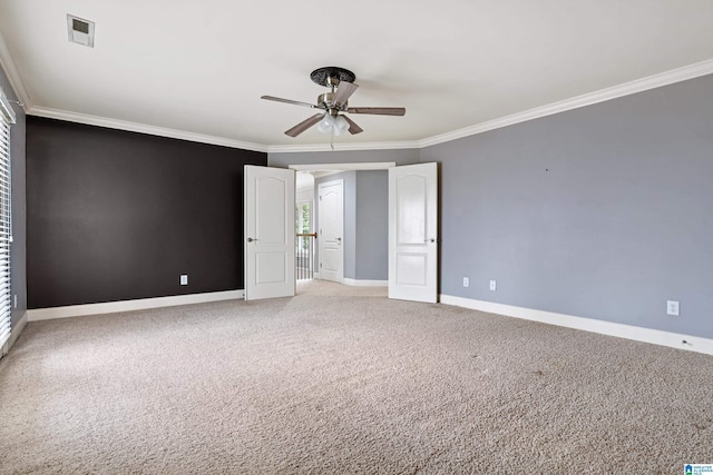 unfurnished bedroom featuring ceiling fan, ornamental molding, and carpet flooring