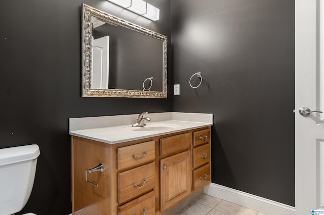 bathroom with vanity, tile patterned floors, and toilet