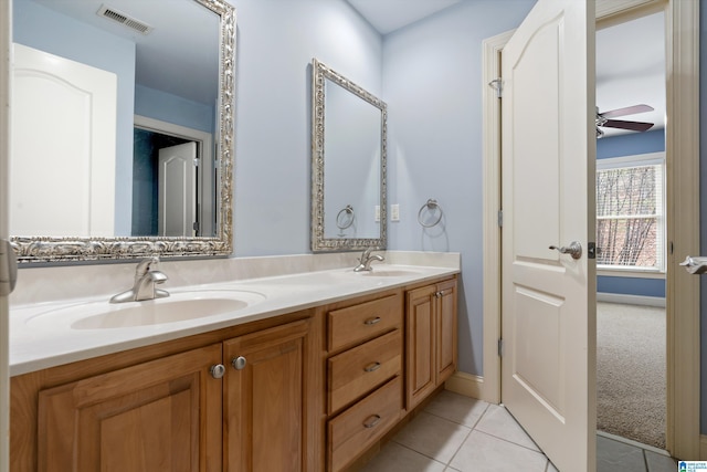 bathroom featuring tile patterned flooring, vanity, and ceiling fan