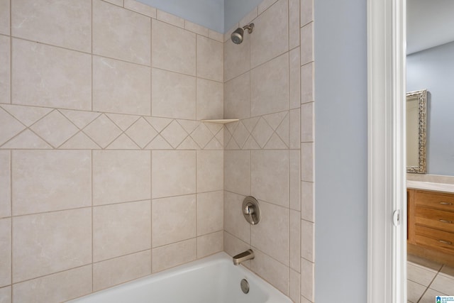 bathroom featuring vanity and tiled shower / bath combo