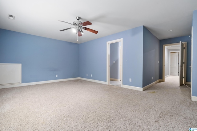 unfurnished room with light carpet and ceiling fan