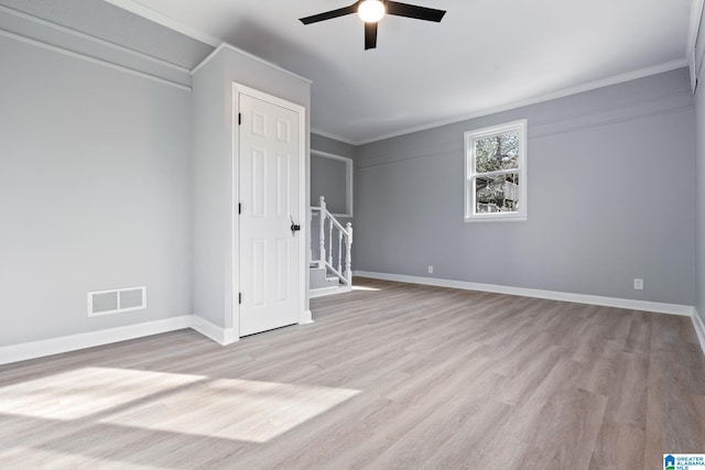 unfurnished room featuring ornamental molding, ceiling fan, and light hardwood / wood-style flooring