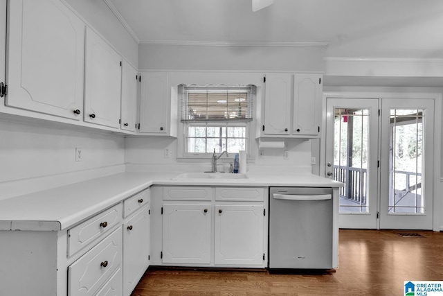 kitchen featuring white cabinetry, sink, ornamental molding, stainless steel dishwasher, and dark wood-type flooring