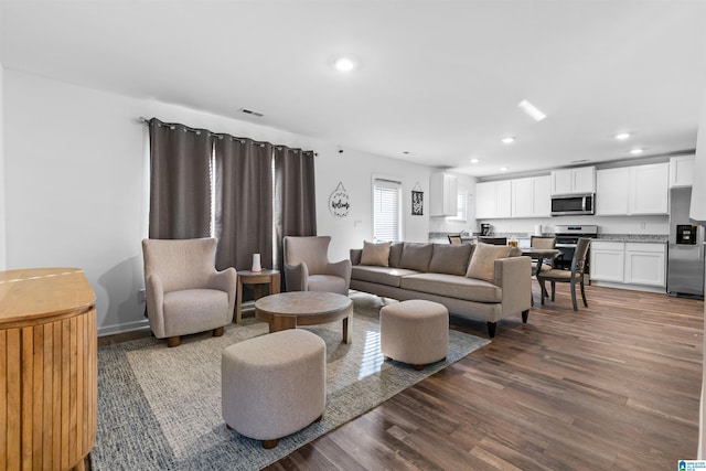 living room with dark wood-type flooring