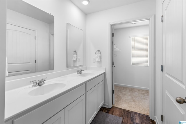 bathroom with vanity and hardwood / wood-style floors