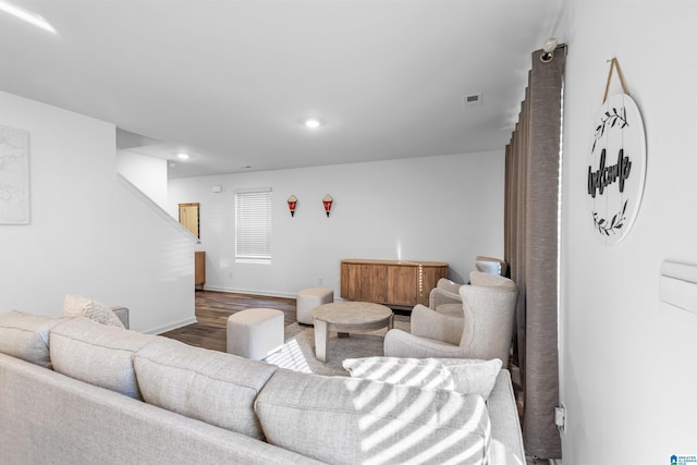 living room with dark hardwood / wood-style flooring