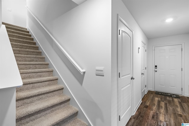 stairway featuring hardwood / wood-style flooring