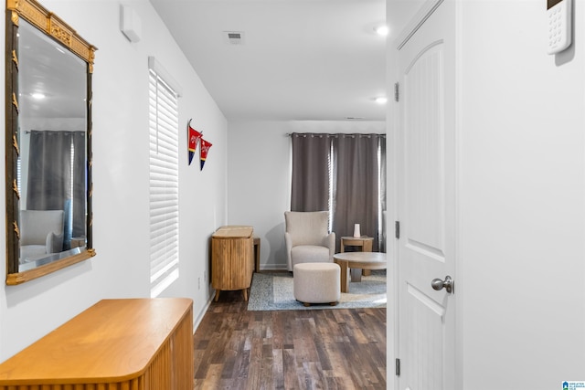 living area with dark hardwood / wood-style floors