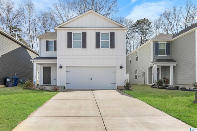 view of front property featuring a garage and a front lawn