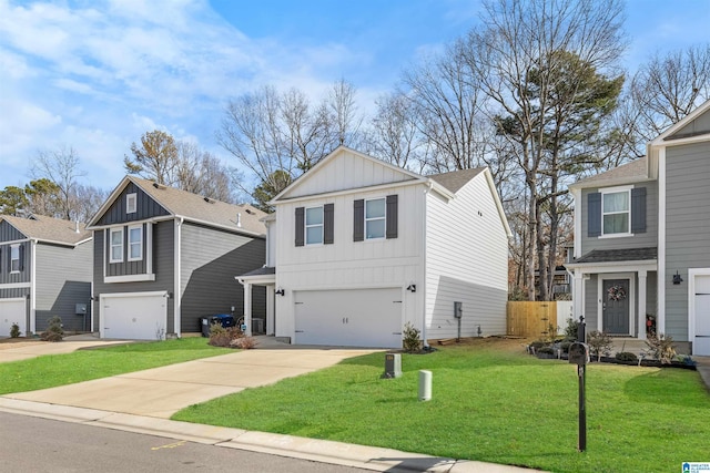 view of property with a garage and a front lawn