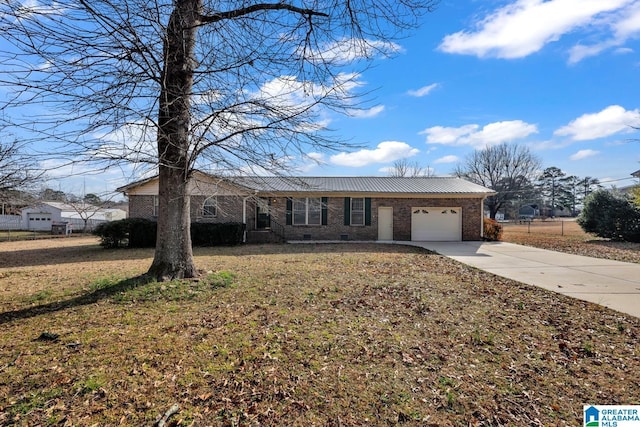 single story home with a garage and a front yard