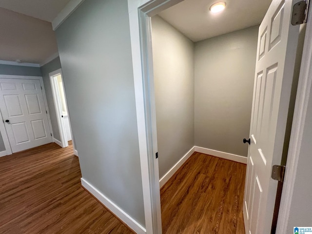 hallway with dark hardwood / wood-style flooring