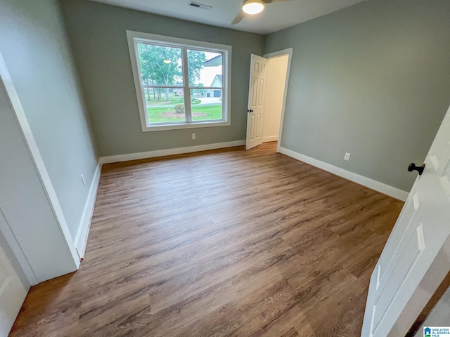 unfurnished bedroom featuring ceiling fan and hardwood / wood-style floors