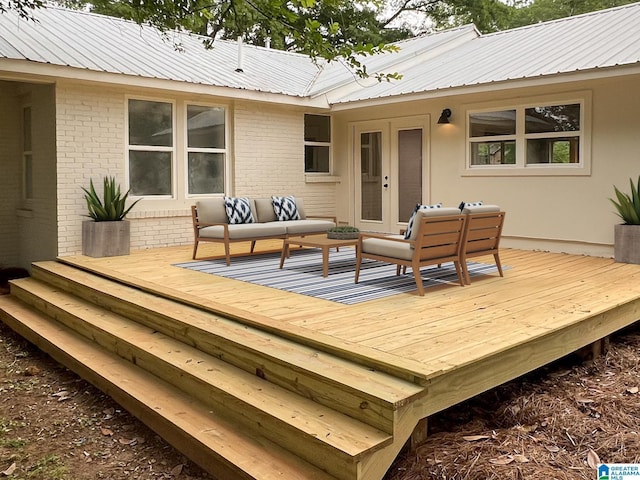 wooden terrace with an outdoor hangout area