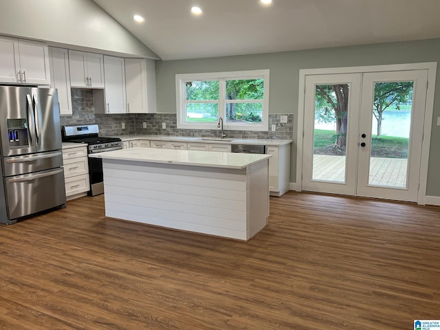 kitchen featuring dark wood-type flooring, sink, a kitchen island, stainless steel appliances, and white cabinets