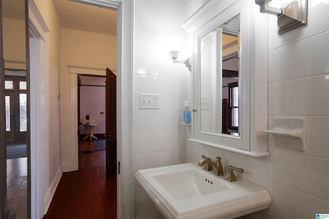 bathroom with sink, tile walls, and tile patterned floors