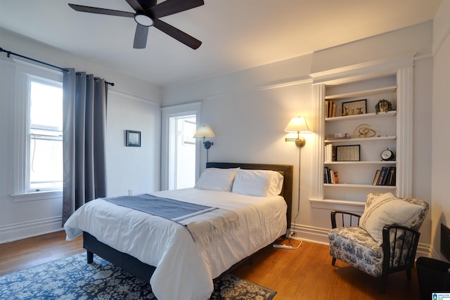 bedroom featuring hardwood / wood-style flooring and ceiling fan