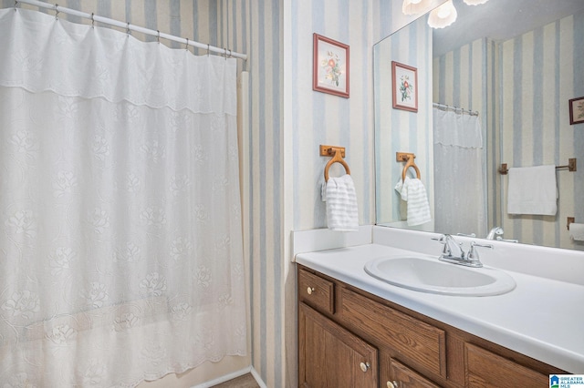 bathroom with vanity and walk in shower