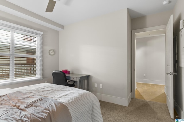 bedroom with light colored carpet and ceiling fan