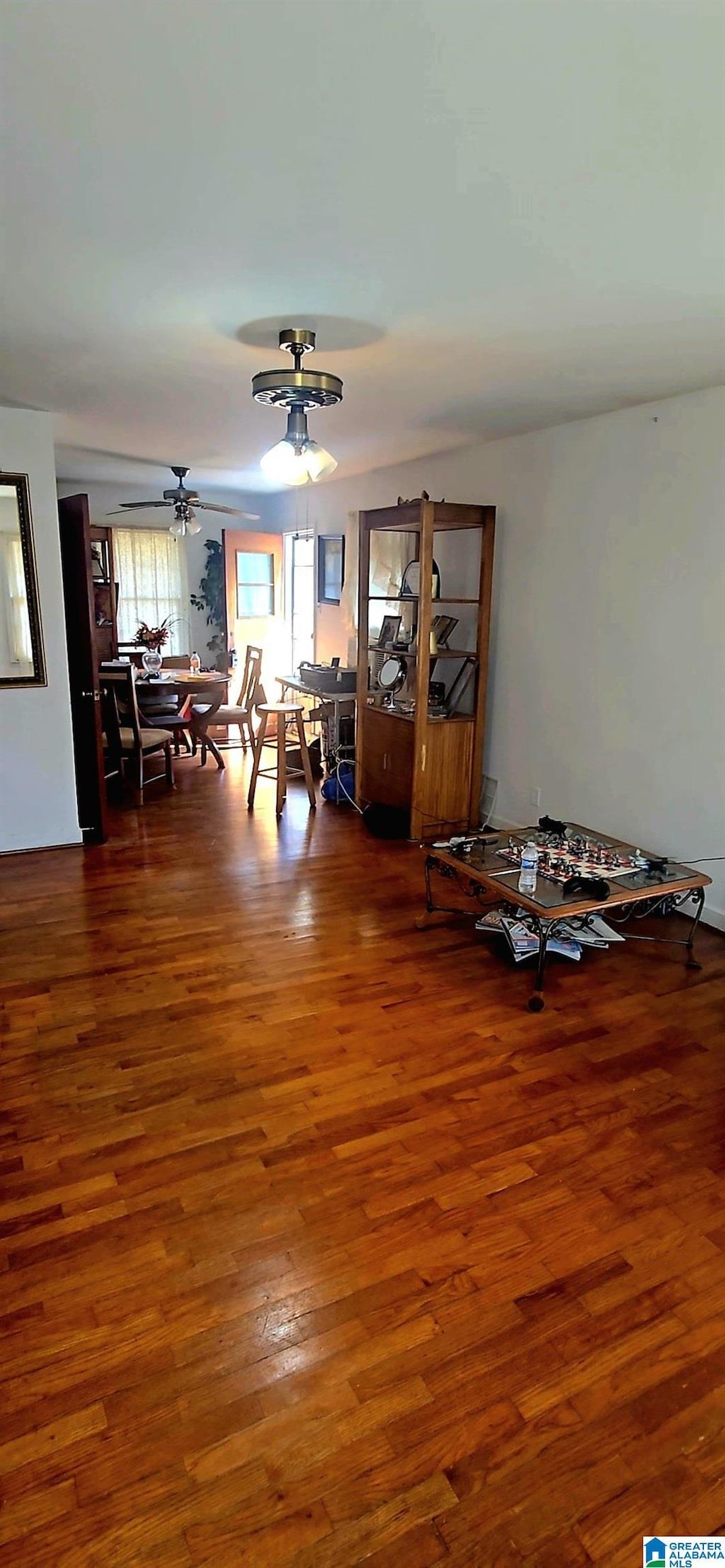 interior space featuring hardwood / wood-style flooring and ceiling fan