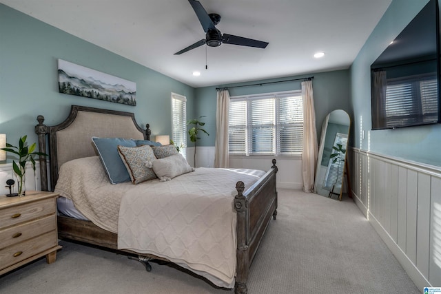 bedroom featuring ceiling fan and light carpet