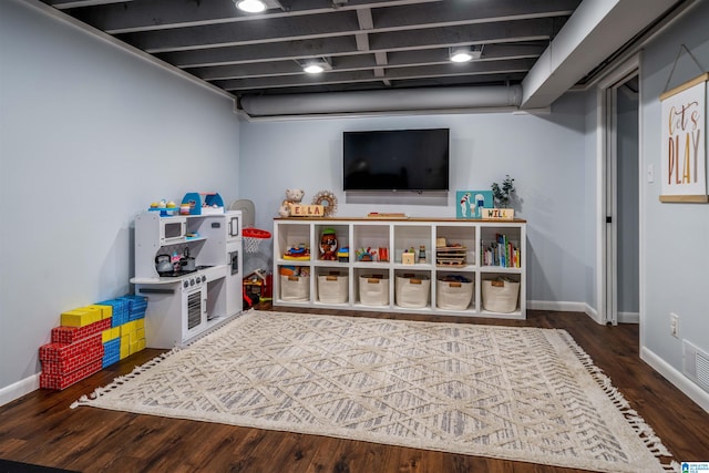 recreation room featuring dark hardwood / wood-style flooring